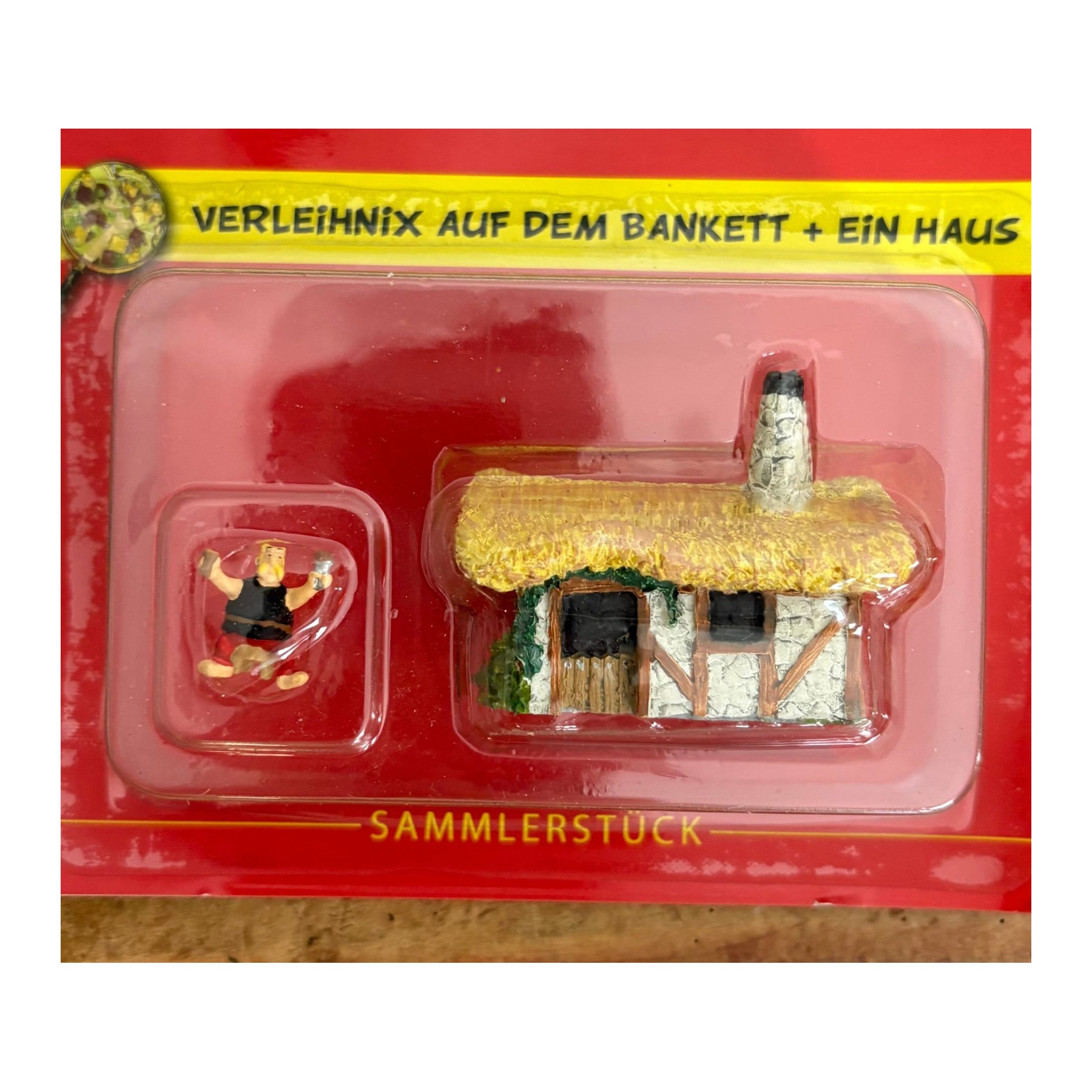 N° 52 – Ordralfabétix au banquet et une maison – blister Village Astérix Atlas